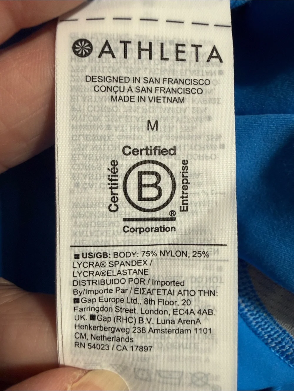 ATHLETA Bright Blue Salutation Stash 7/8 Tight with Side Pockets Size Medium